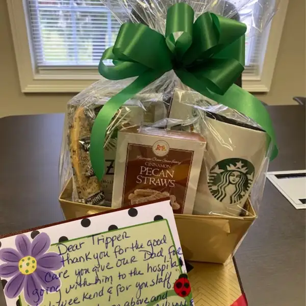 A basket of coffee and tea with a note.