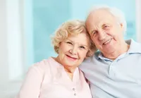 A man and woman smiling for the camera.