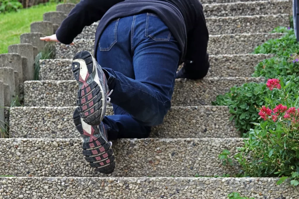 A person falling down stairs on the ground.