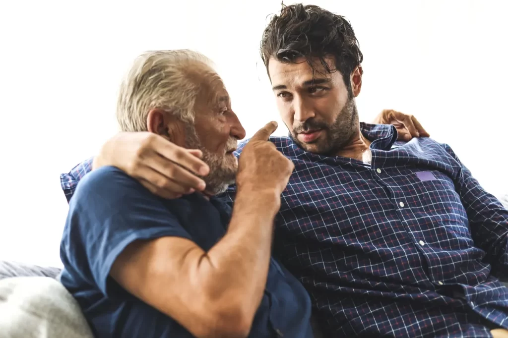 A man and an old man are sitting together