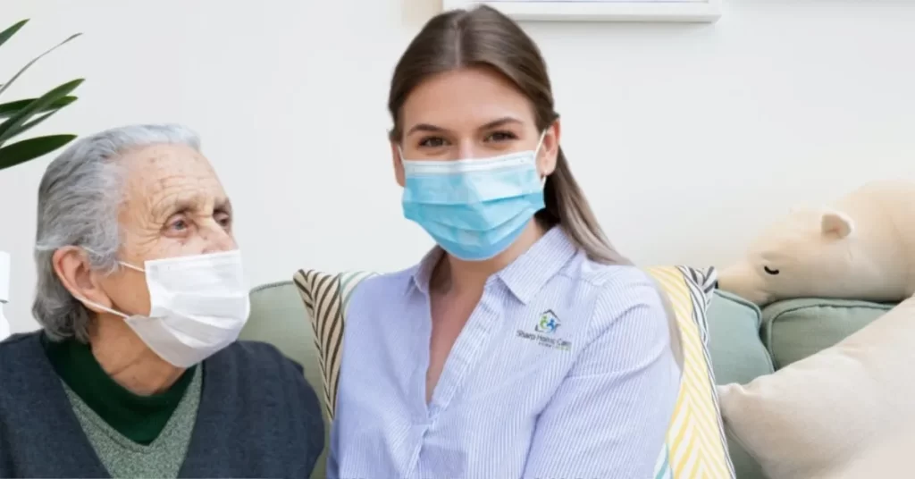 A woman wearing a face mask sitting on the couch.