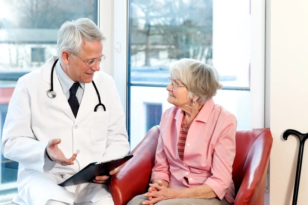 A doctor and patient in an office setting.